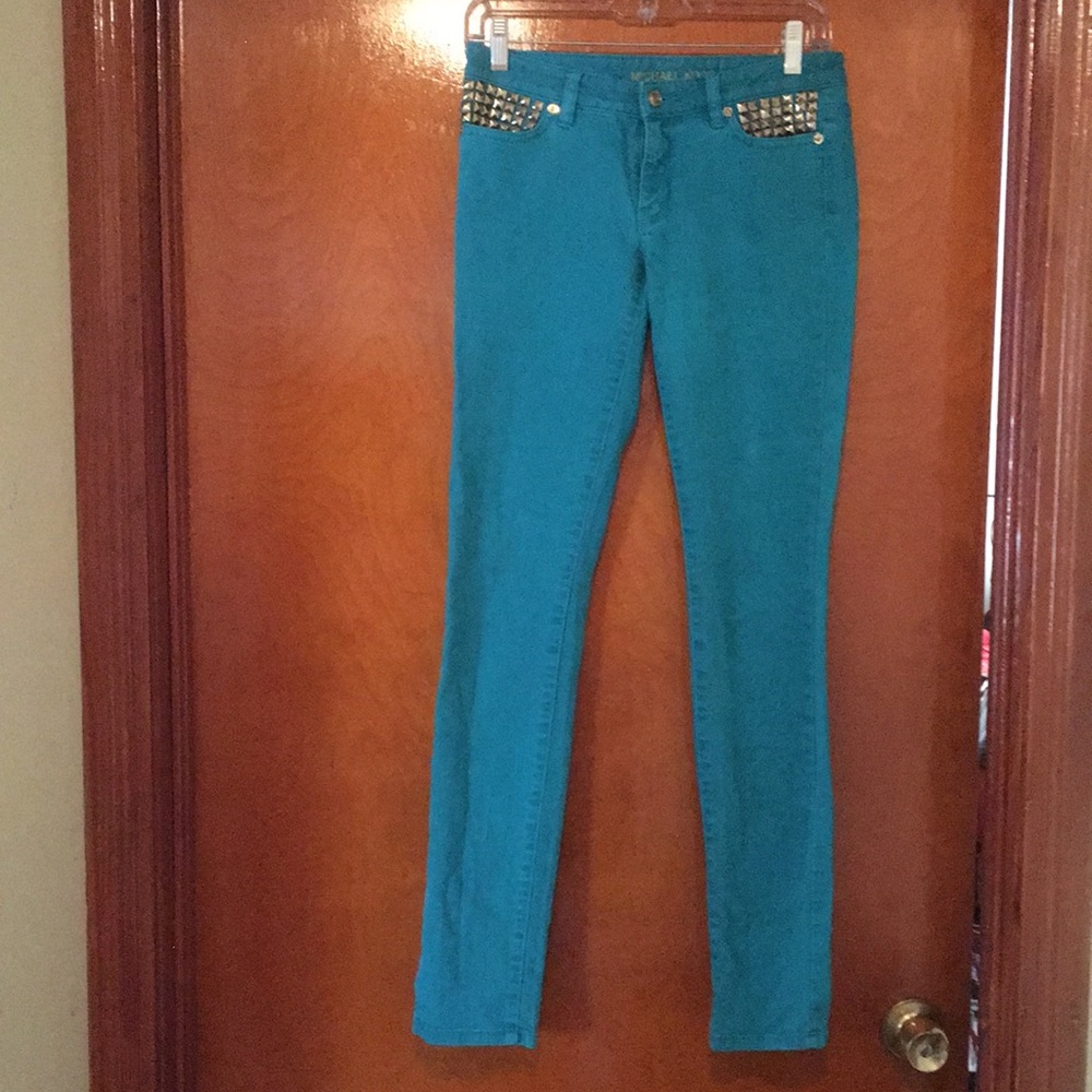 Super trendy pair of studded turquoise Michael Kors skinny jeans. Like new!